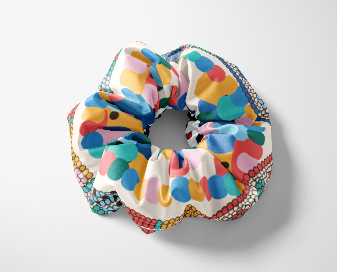 The Alice silk scrunchie in the hand-drawn Alice print — CB Grey